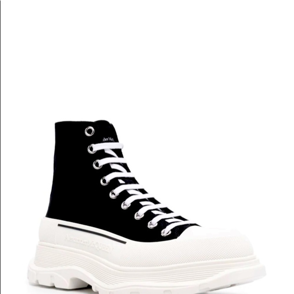 Black canvas Tread Slick sneakers with white rubber sole.